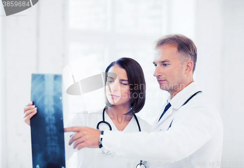 Image of two doctors looking at x-ray