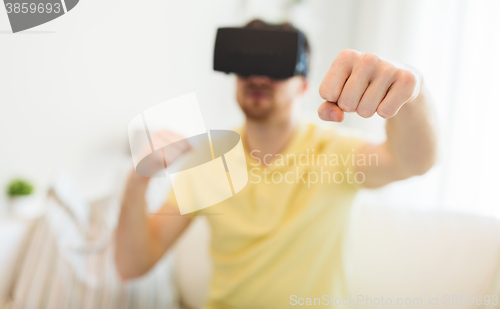 Image of young man in virtual reality headset or 3d glasses