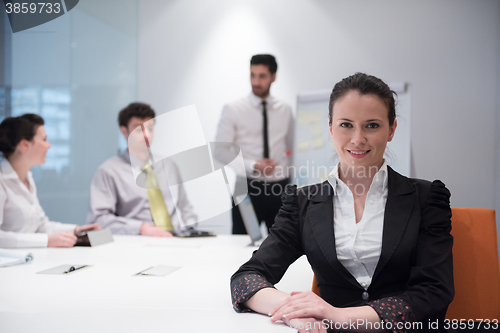 Image of young business woman on meeting  using laptop computer