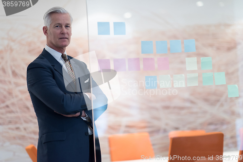 Image of portrait of handsome senior business man at modern office