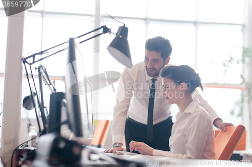 Image of business couple working together on project