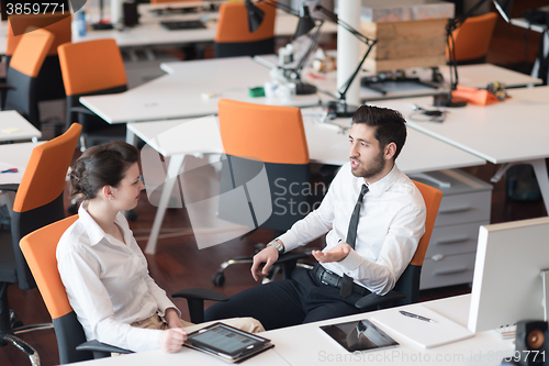 Image of business couple working together on project