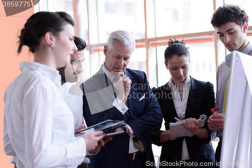 Image of young startup businessman making presentation to senior investio