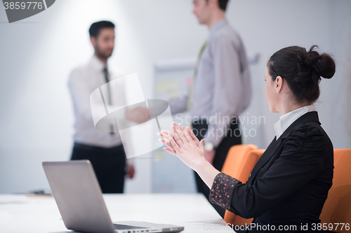 Image of young business woman on meeting  using laptop computer