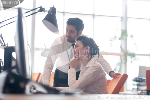 Image of business couple working together on project