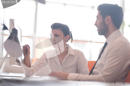 Image of business couple working together on project