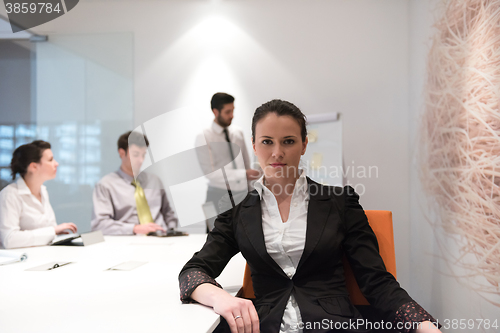 Image of young business woman on meeting  using laptop computer