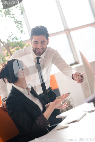 Image of business couple working together on project