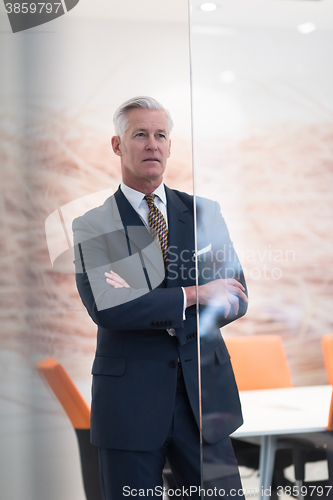Image of portrait of handsome senior business man at modern office