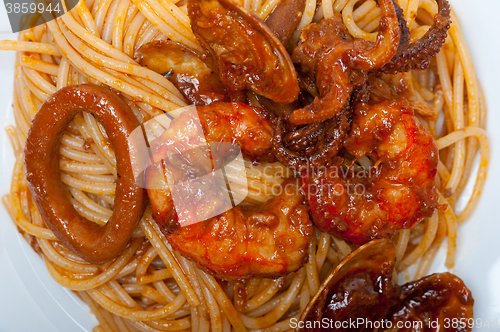 Image of Italian seafood spaghetti pasta on red tomato sauce 