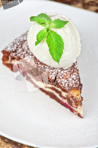 Image of chocolate cake with jam ice cream