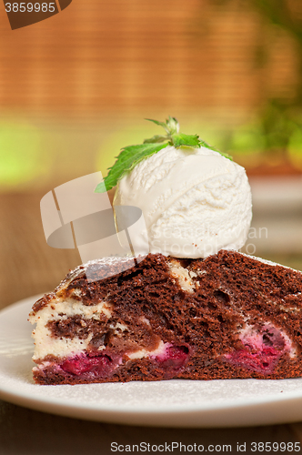 Image of chocolate cake with jam ice cream