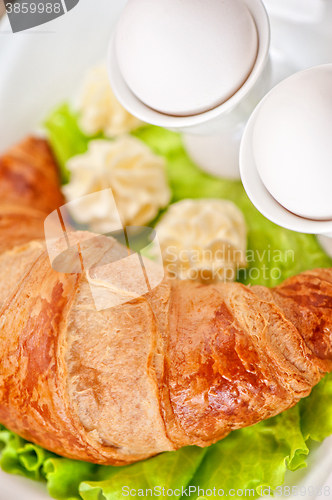 Image of breakfast from eggs and croissant