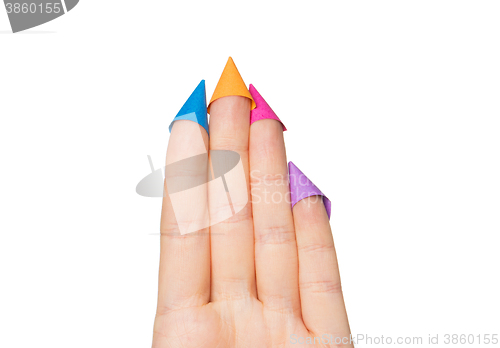 Image of close up of hand with four fingers in party hats