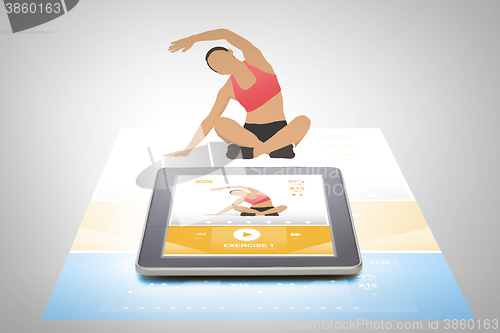 Image of tablet pc with fitness application on screen