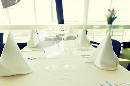 Image of close up of table setting with glasses and cutlery