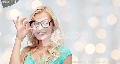 Image of happy young woman or teenage girl in glasses