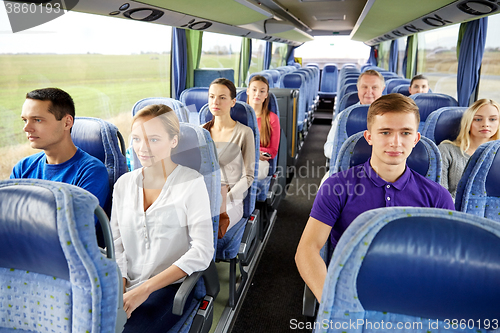 Image of group of passengers or tourists in travel bus