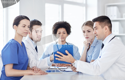 Image of group of happy doctors meeting at hospital office