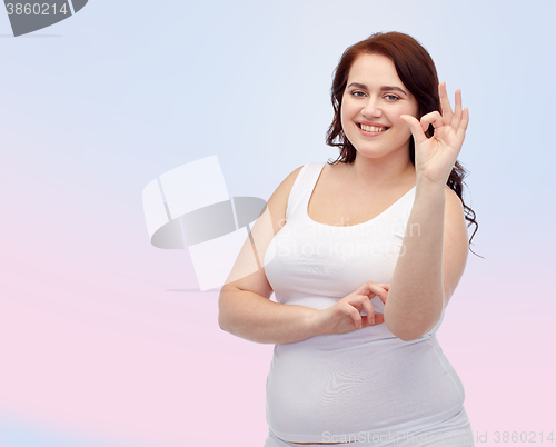 Image of plus size woman in underwear showing ok hand sign