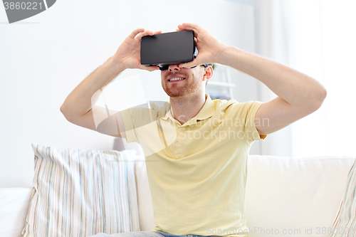 Image of young man in virtual reality headset or 3d glasses