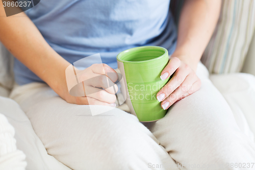 Image of close up of young woman with tea cup