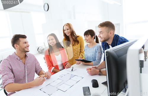 Image of happy creative team or students working at office