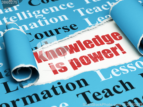Image of Studying concept: red text Knowledge Is power! under the piece of  torn paper