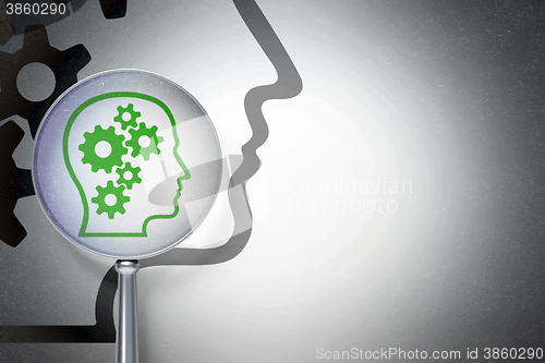 Image of Information concept:  Head With Gears with optical glass on digital background