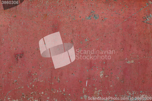 Image of Old red cracked paint on metal background