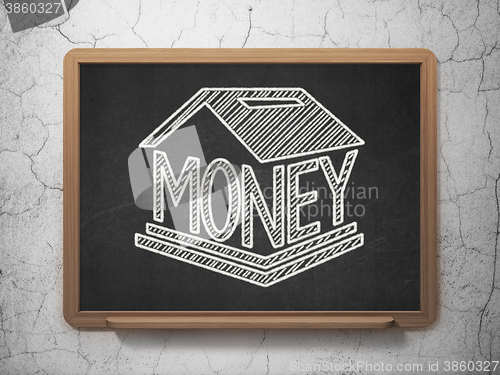 Image of Currency concept: Money Box on chalkboard background