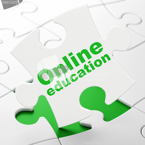 Image of Education concept: Online Education on puzzle background