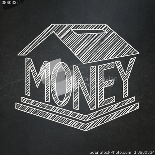 Image of Currency concept: Money Box on chalkboard background