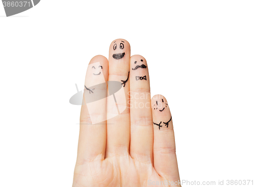 Image of close up of hands and fingers with smiley faces