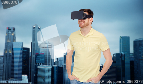 Image of happy man in virtual reality headset or 3d glasses