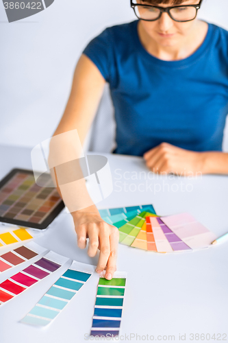 Image of woman working with color samples for selection