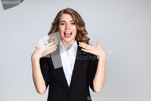 Image of Portrait of young woman with shocked facial expression