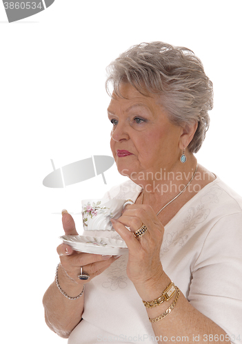 Image of Senior woman drinking coffee.