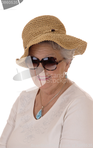 Image of Senior woman with straw hat.
