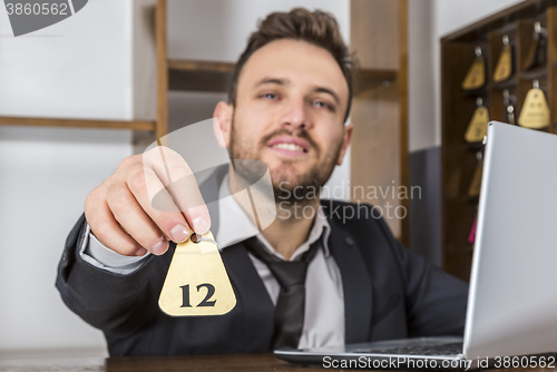 Image of Receptionist Giving the Key