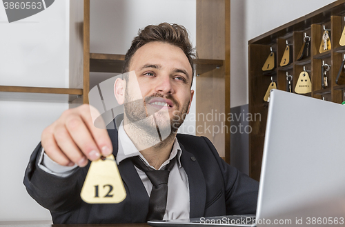 Image of Receptionist Giving the Key