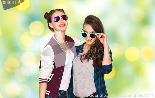 Image of happy smiling pretty teenage girls in sunglasses