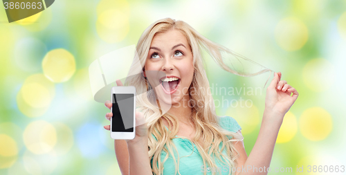 Image of happy young woman or teenage girl with smartphone