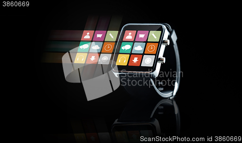 Image of close up of black smart watch with app icons