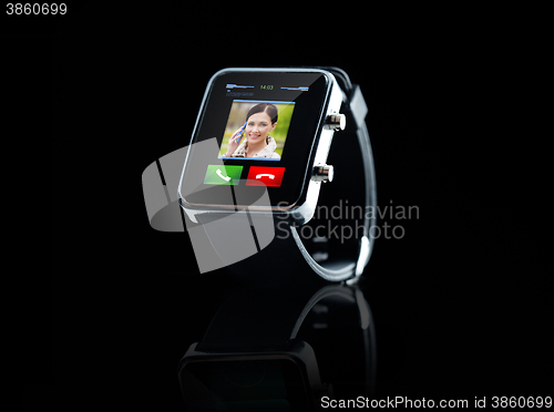 Image of close up of black smart watch with incoming call