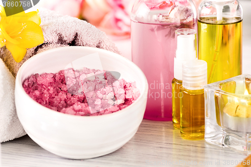 Image of Spa setting with pink roses and aroma oil, vintage style 