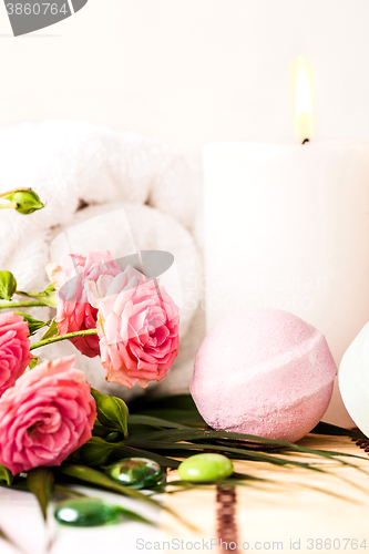 Image of Spa setting with pink roses and aroma oil, vintage style 