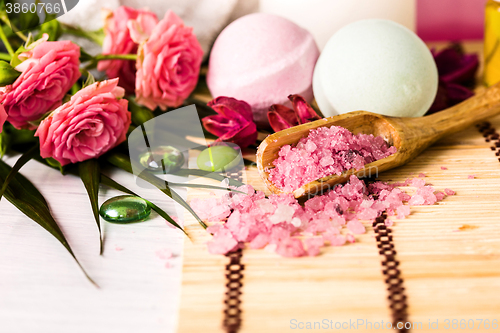 Image of Spa setting with pink roses and aroma oil, vintage style 