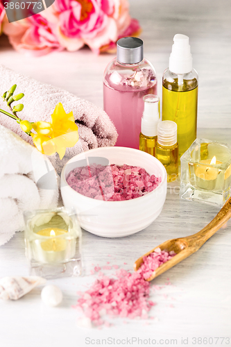 Image of Spa setting with pink roses and aroma oil, vintage style 