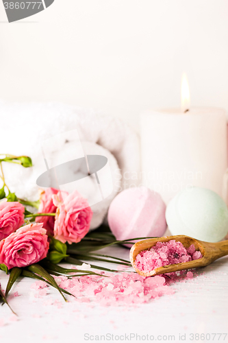 Image of Spa setting with pink roses and aroma oil, vintage style 